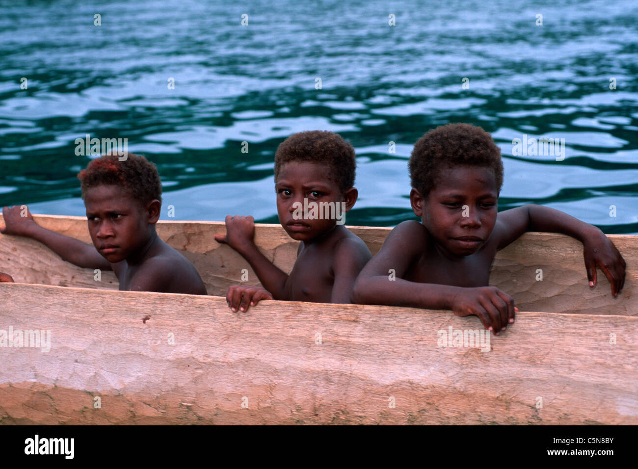 Children of Vitu Islands in Trigger Boat, Vitu Islands, Bismarck Archipelago, Papua New Guinea Stock Photo
