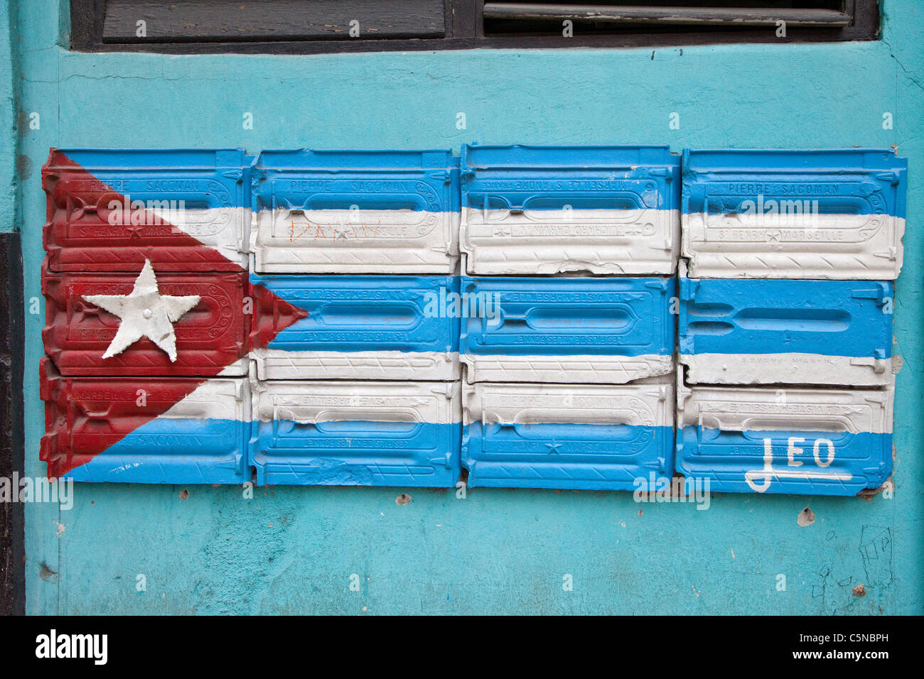 Cuba, Havana. Cuban Flag Painted On Side of Building as Decoration, Central Havana. Stock Photo