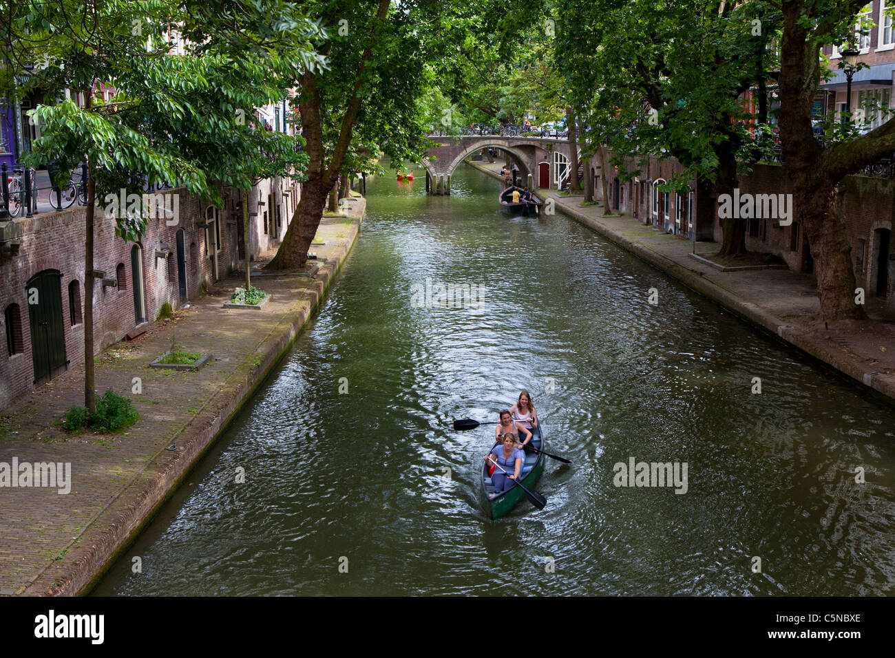 Canoing on the Oudegracht canal, Utrecht, Netherlands Stock Photo