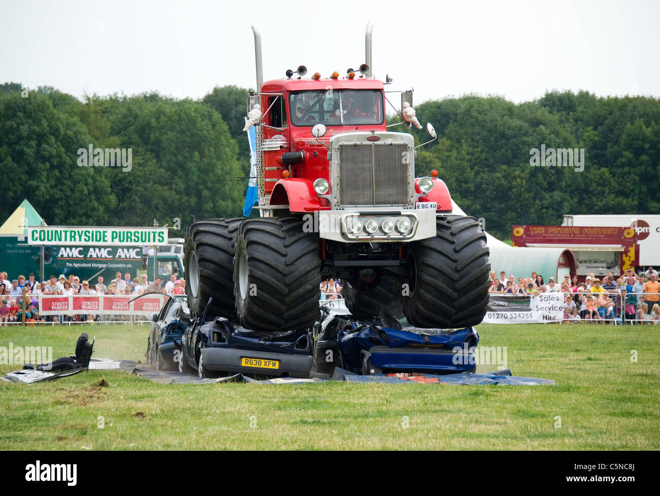 Monster Truck crushing cars, Nantwich Show, UK Stock Photo Alamy