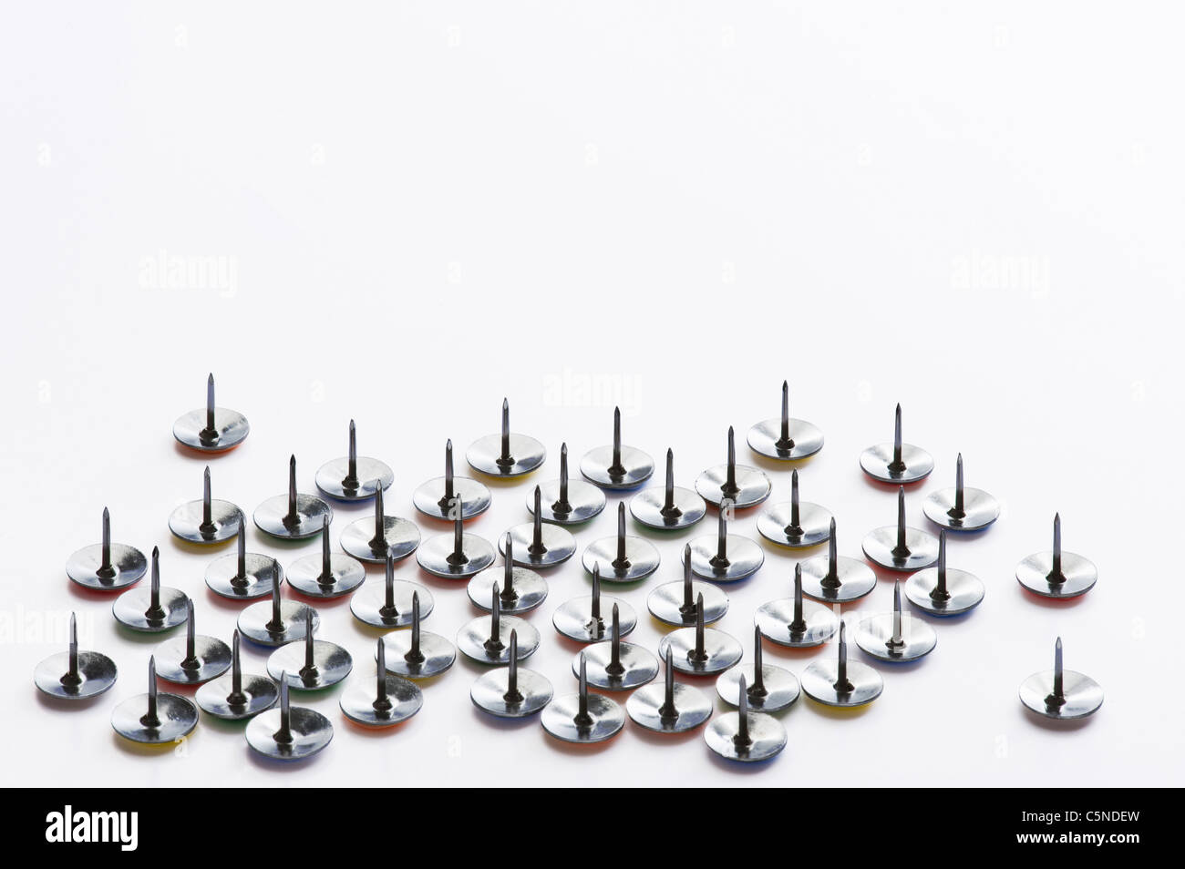 Drawing pins on a white surface Stock Photo Alamy