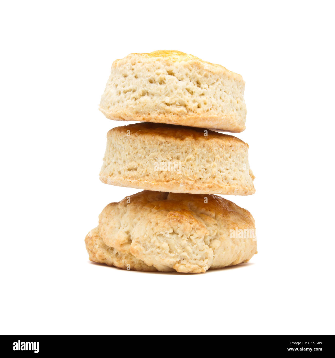 Tower of plain scones from low perspective isolated on white. Stock Photo
