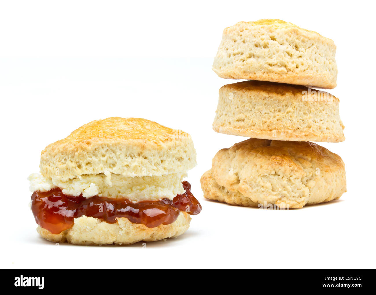 Cream tea Scone with jam from low perspective isolated on white. Stock Photo