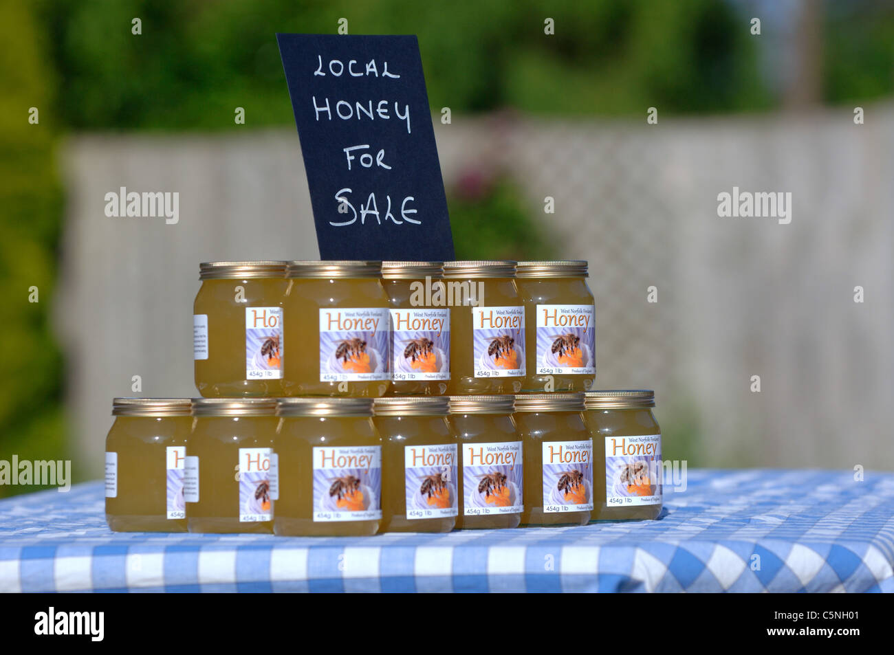 Jars of liquid honey for sale Stock Photo Alamy