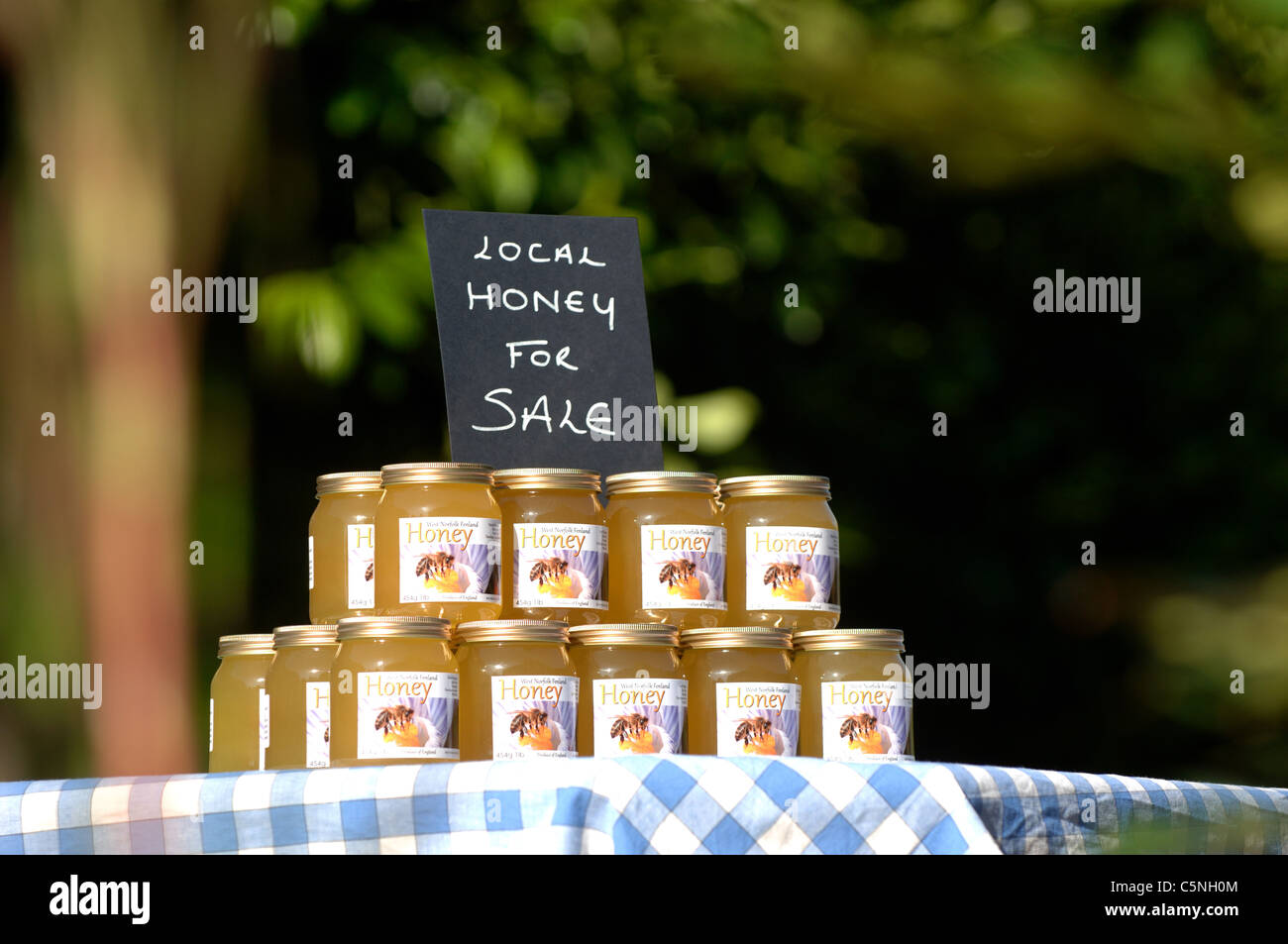Jars of liquid honey for sale Stock Photo Alamy