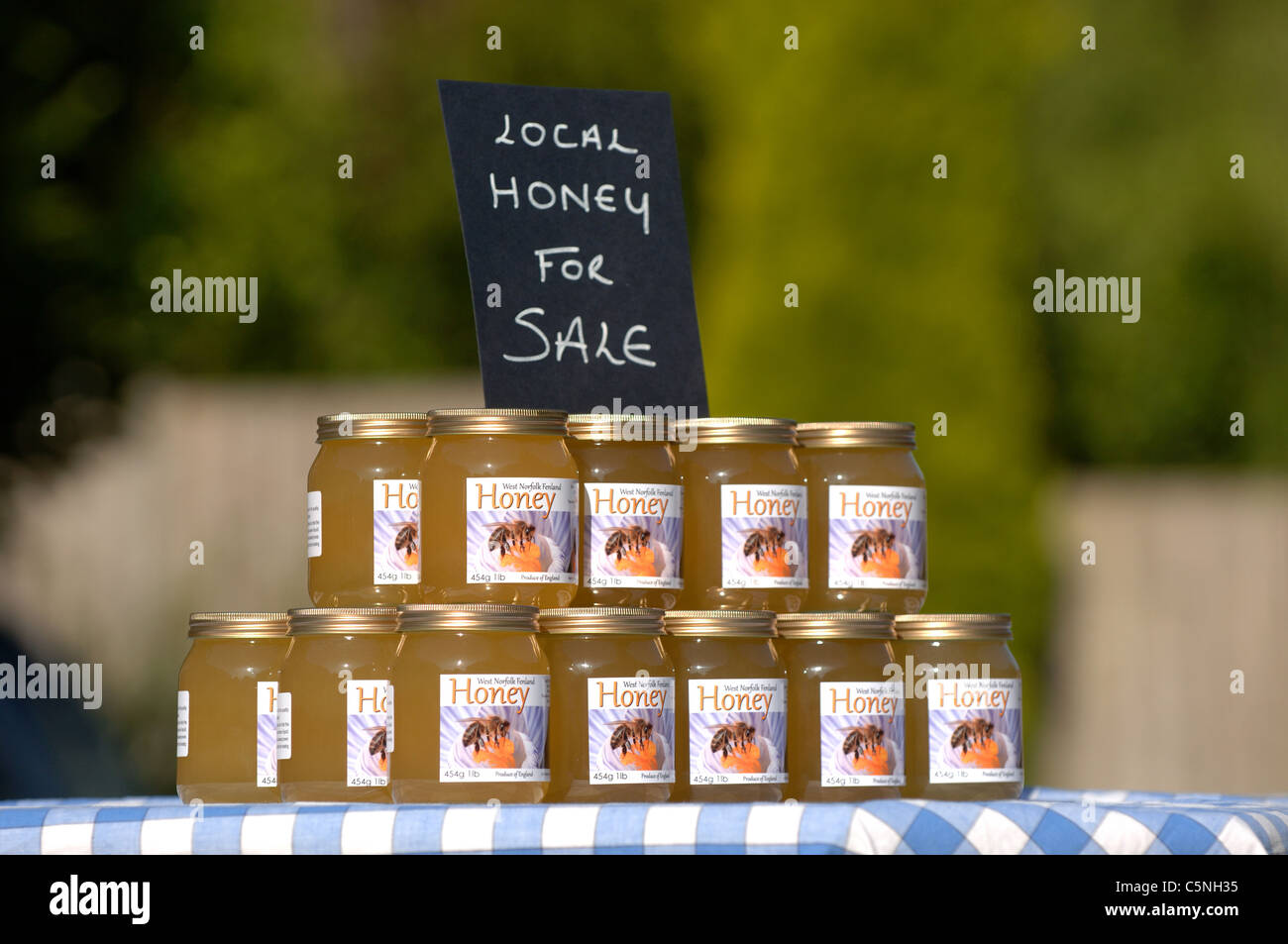 Jars of liquid honey for sale Stock Photo Alamy