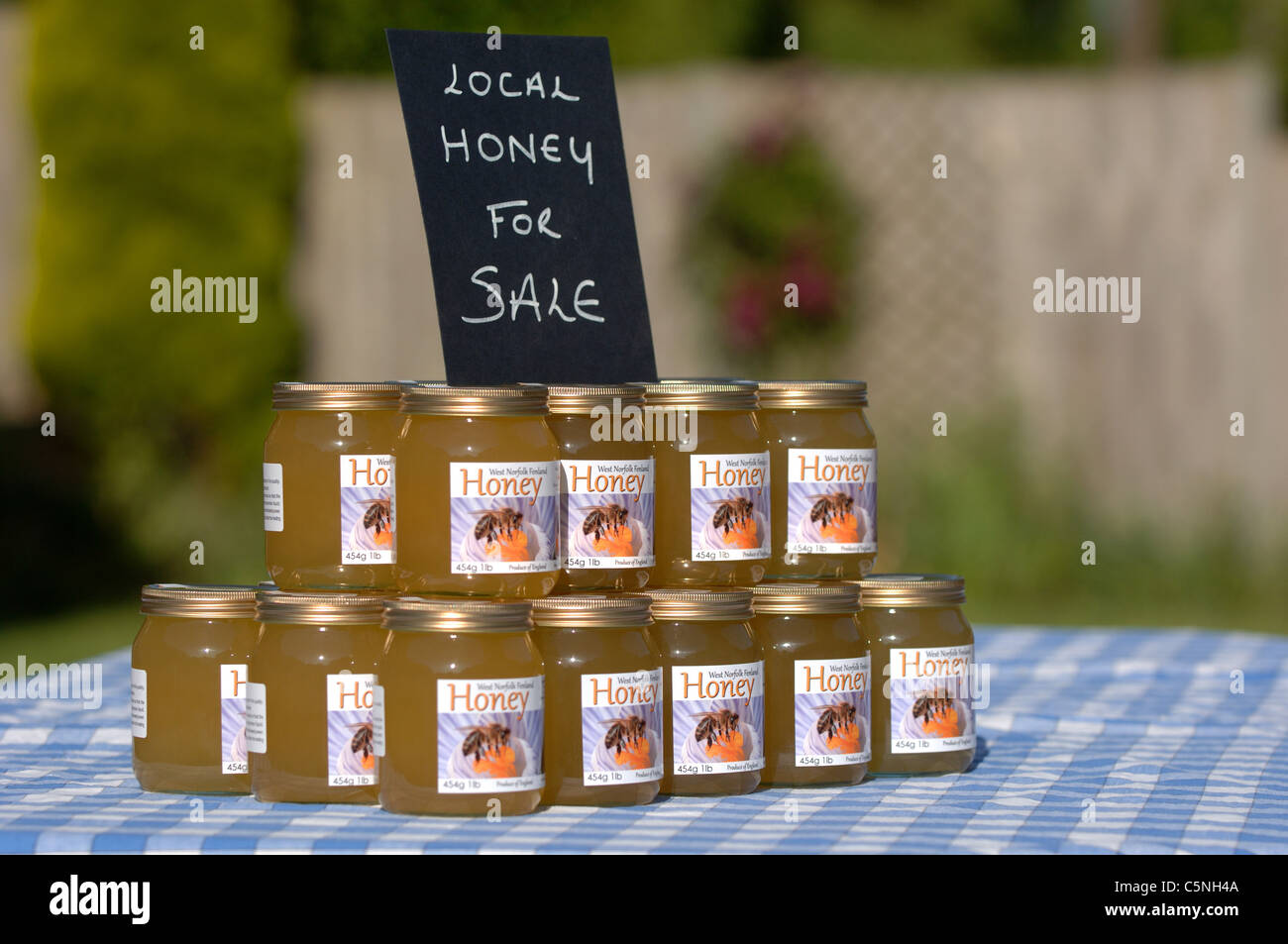 Jars of liquid honey for sale Stock Photo Alamy