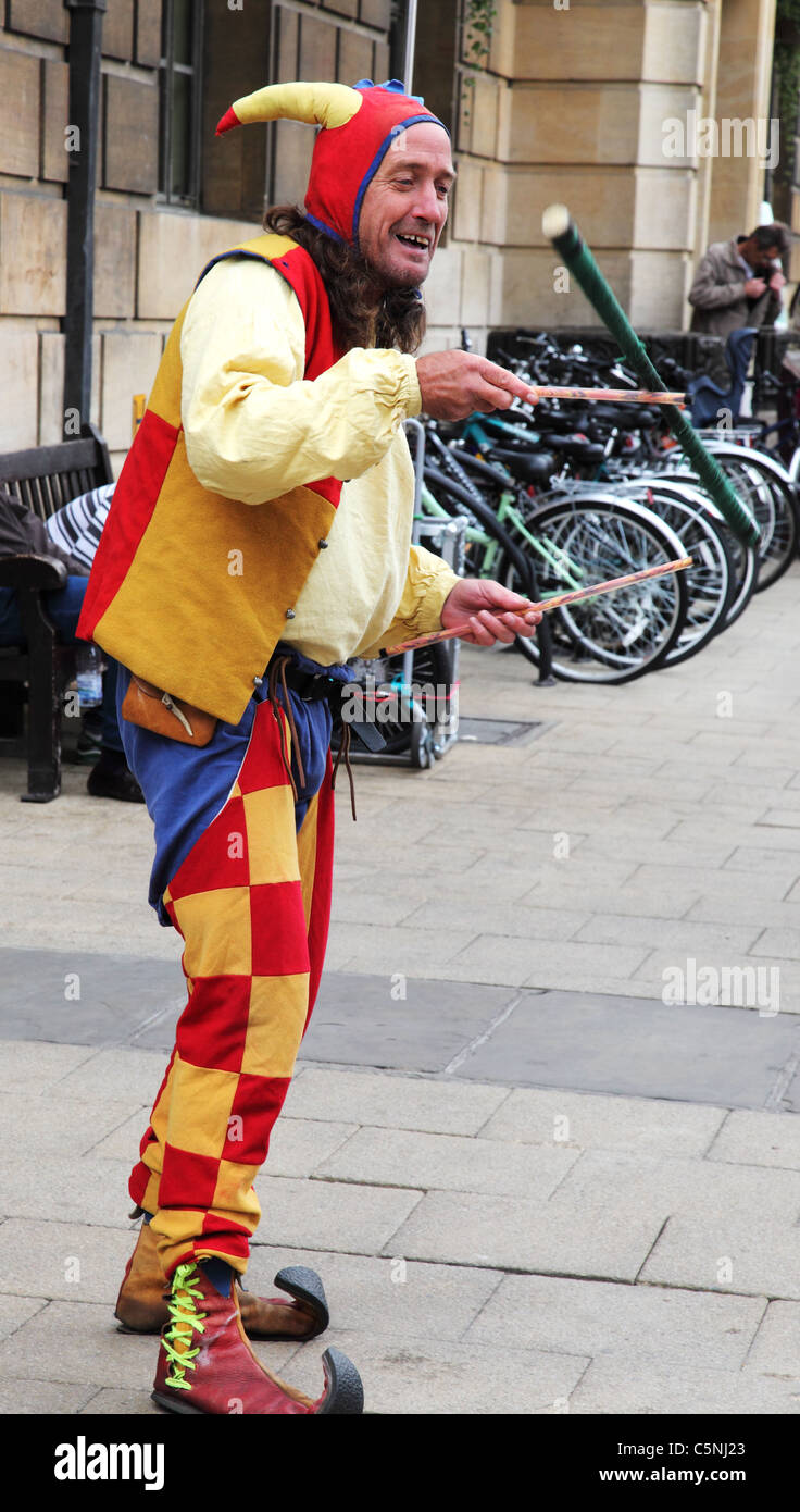 Juggler twirling stick Cambridge Stock Photo