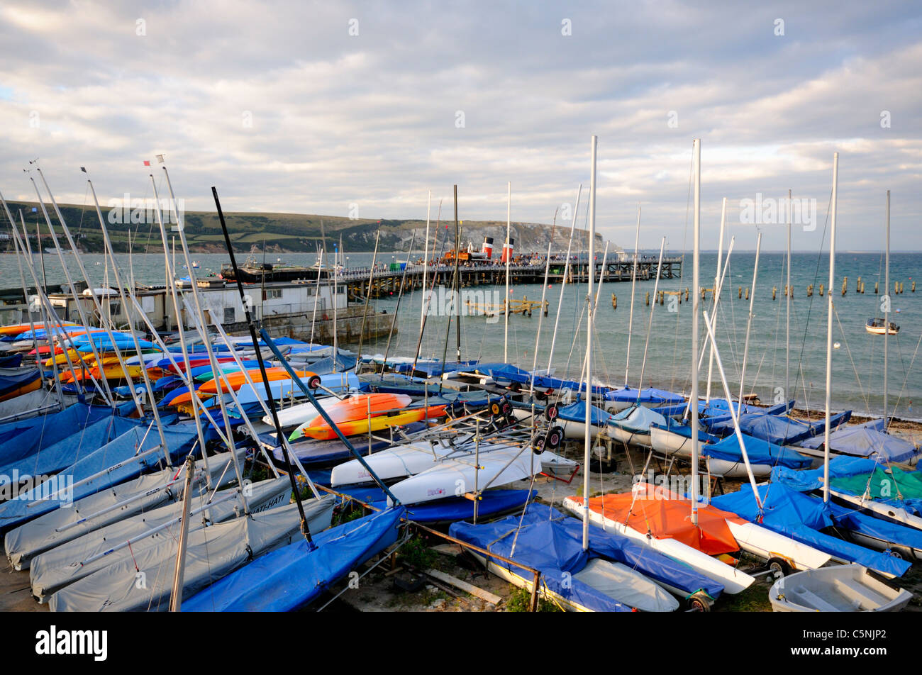 Waverley Paddle Steamer docked at Swanage Pier with Sailing Boats in forground, Dorset, England. Stock Photo