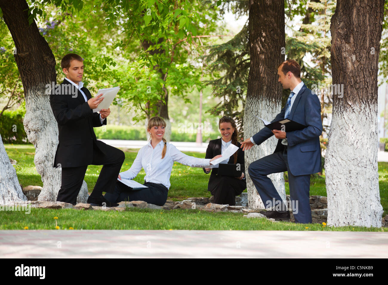 Young business people in a city park Stock Photo - Alamy