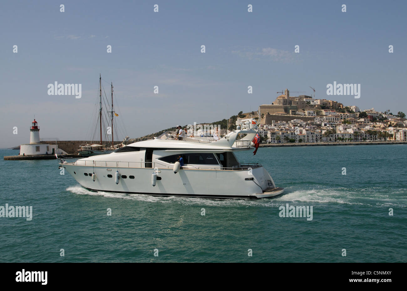 Luxury Maiora motoryacht departing the harbour at Eivissa Ibiza a Spanish Island in the Mediterranean Sea Stock Photo