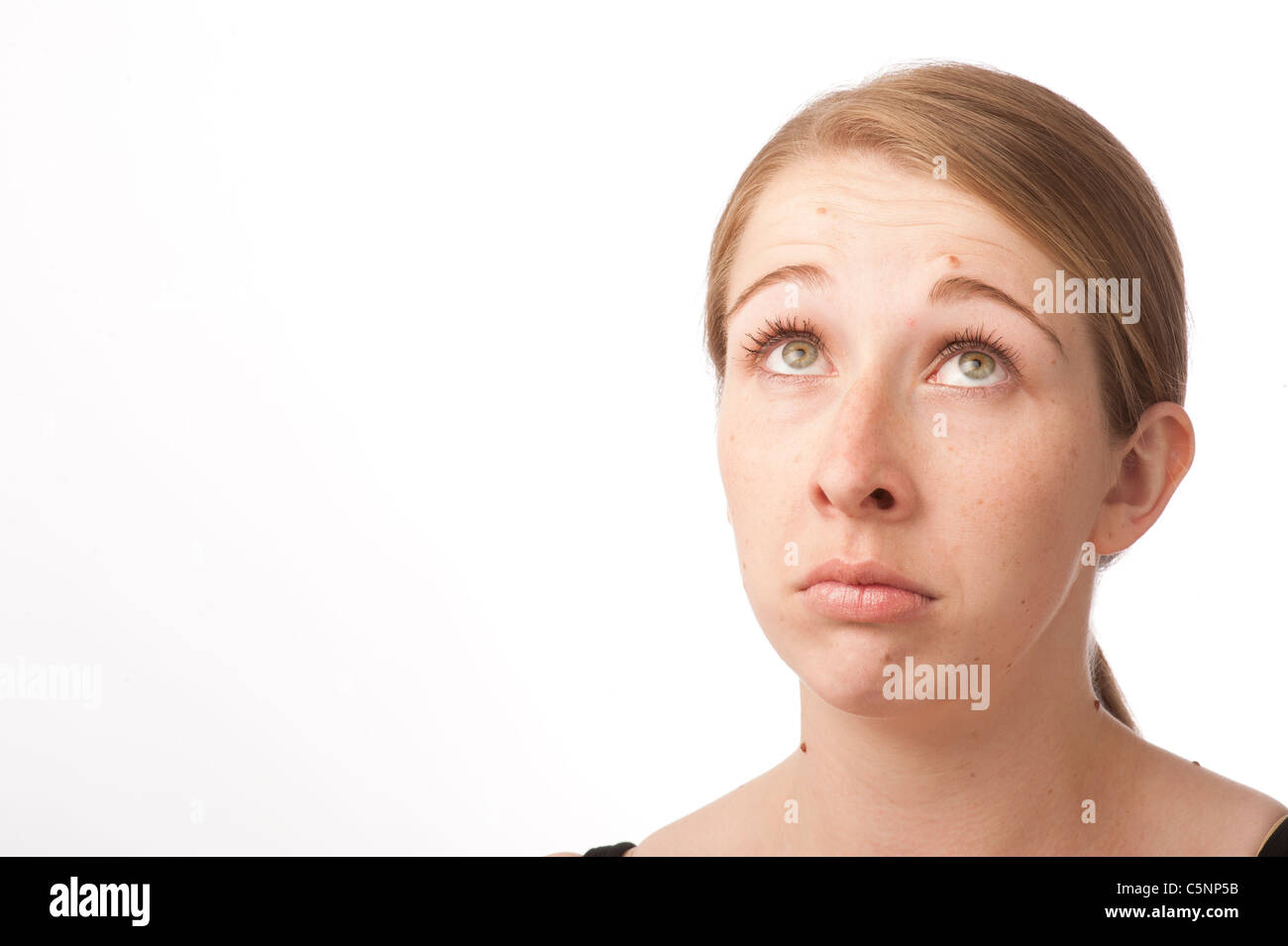 a young caucasian woman looking sad depressed lonely alone Stock Photo