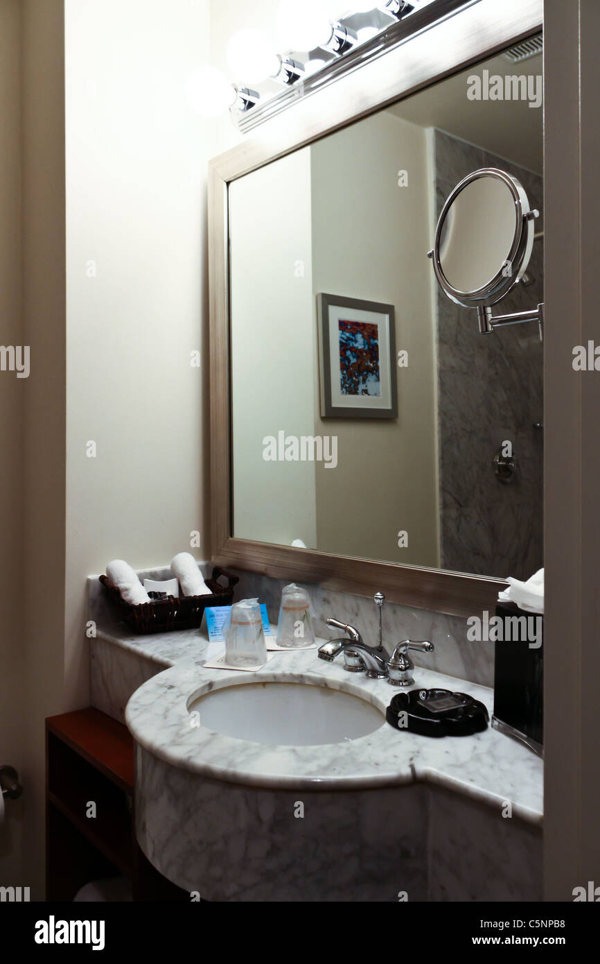 hotel bathroom sink facet mirror Stock Photo