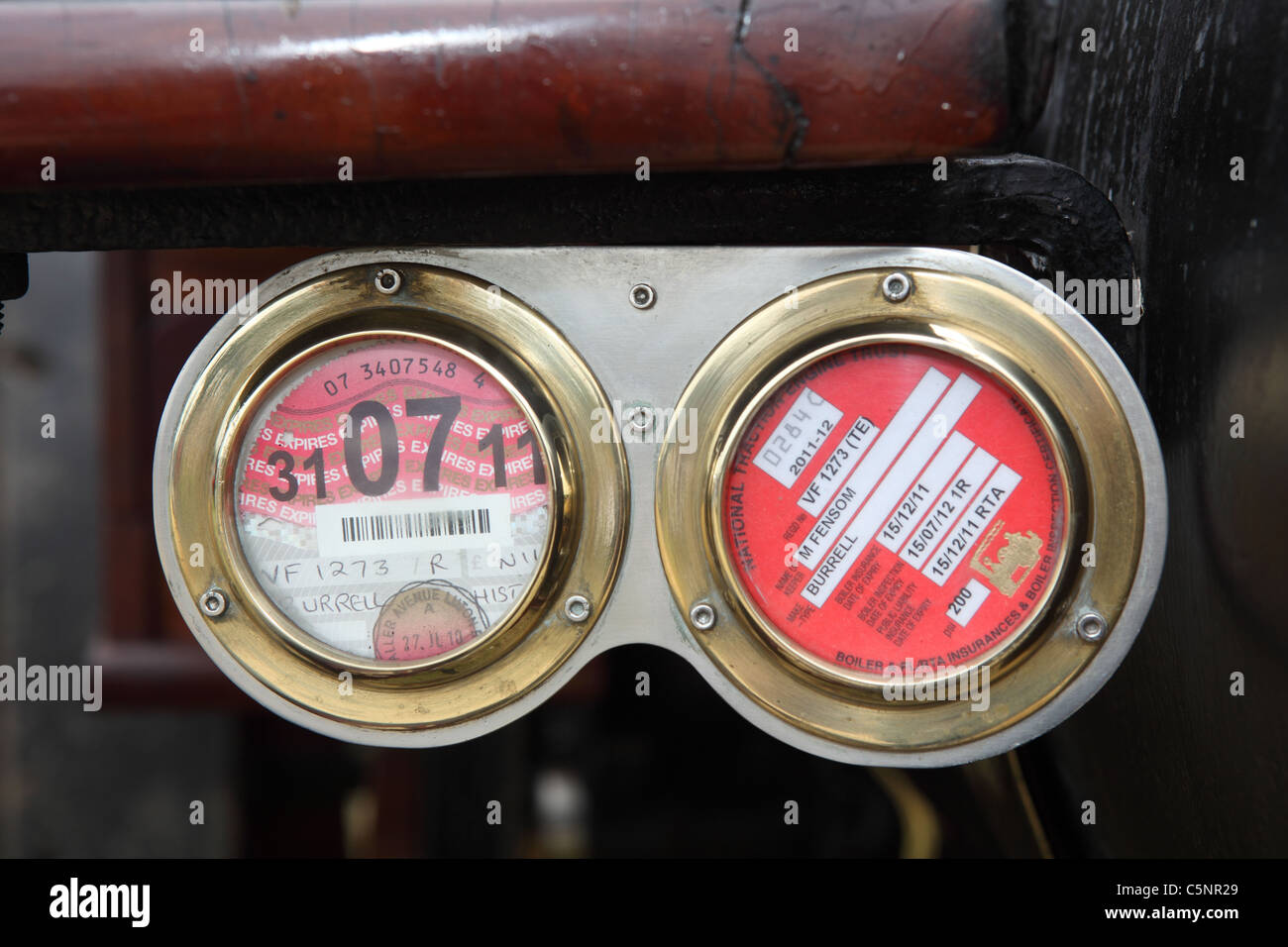 A close up of A tax and insurances disk on A steam traction engine Stock Photo