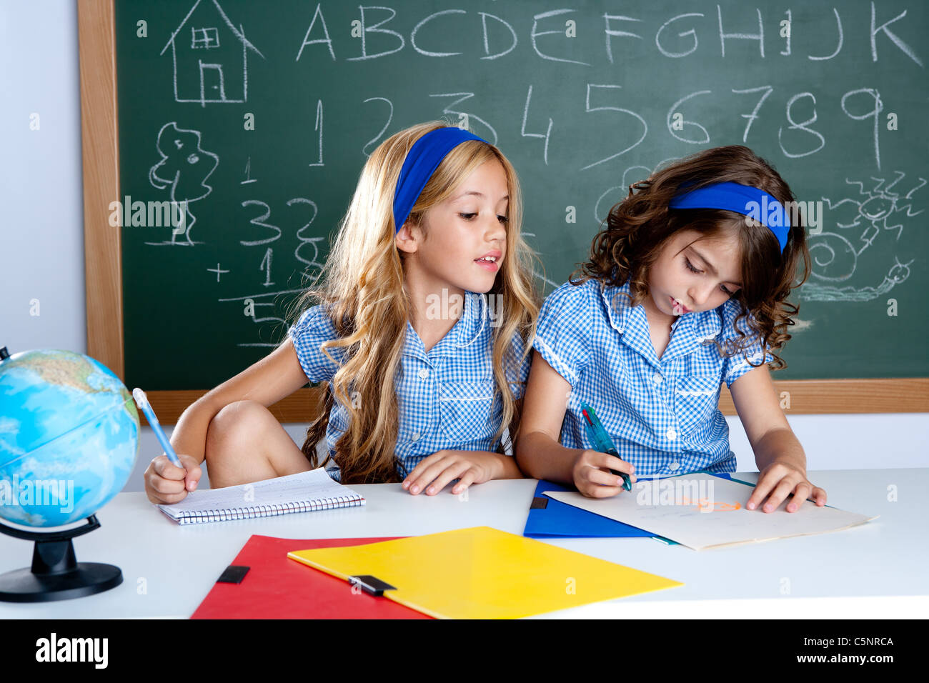 classroom with two kids students cheating on test exam at school