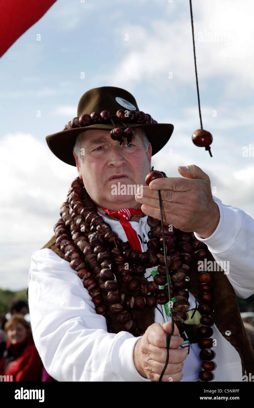 A man playing conkers at The World Conker Championship, held in October ...