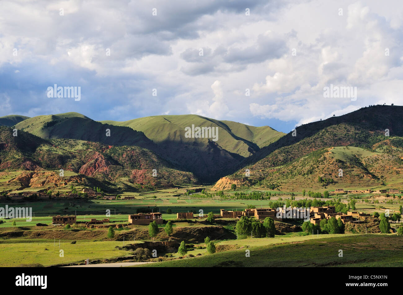 A small Tibetan village at the foot of the mountains. Sichuan Province, China. Stock Photo