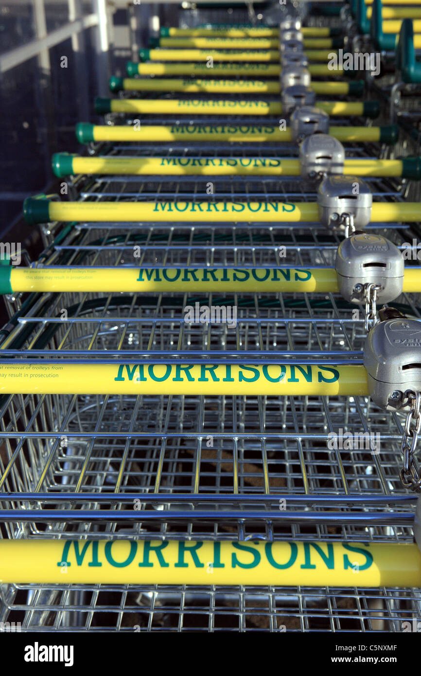 Morrisons supermarket trolleys in a trolley parking bay Stock Photo