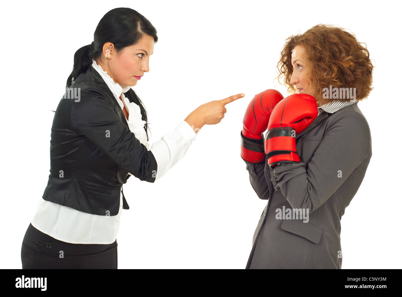 Manager woman pointing and accusing and employee woman who defending with boxing gloves isolated on white background Stock Photo