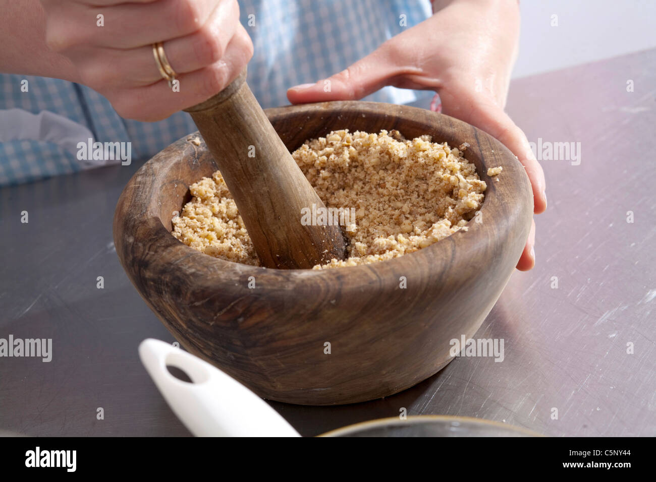 Baklava crushing nuts Stock Photo Alamy