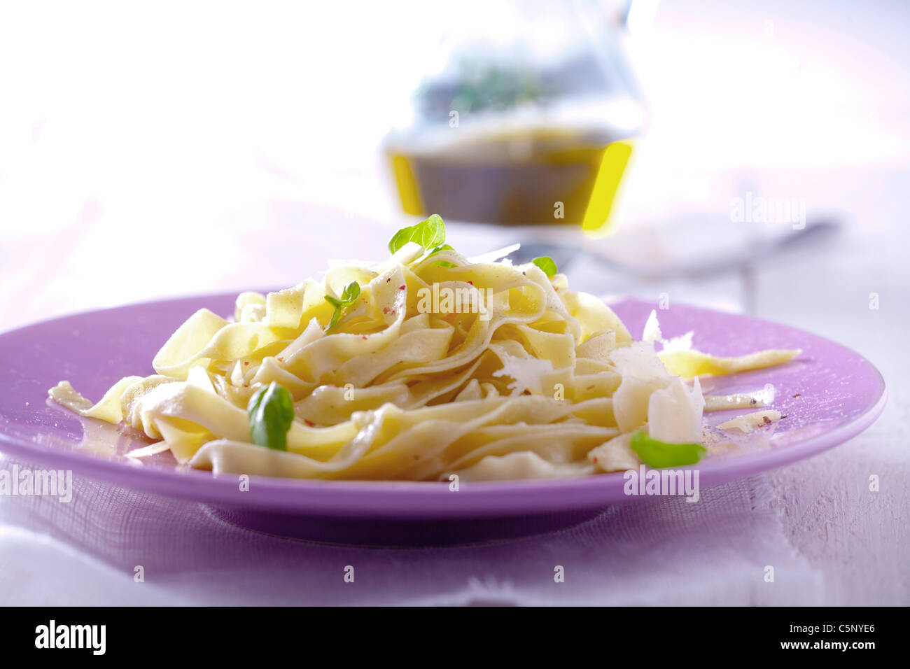 Ribbon pasta with olive oil, parmesan and basil Stock Photo Alamy