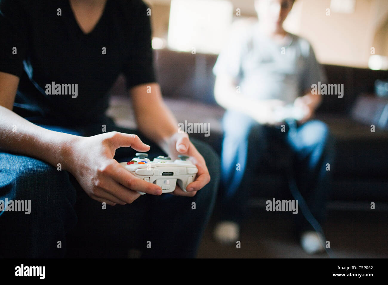 Two boys playing video games Stock Photo