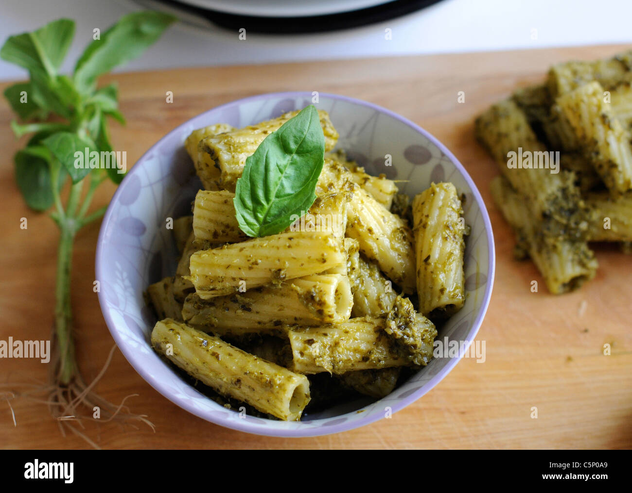 Rigatoni pasta with pesto genovese Stock Photo Alamy