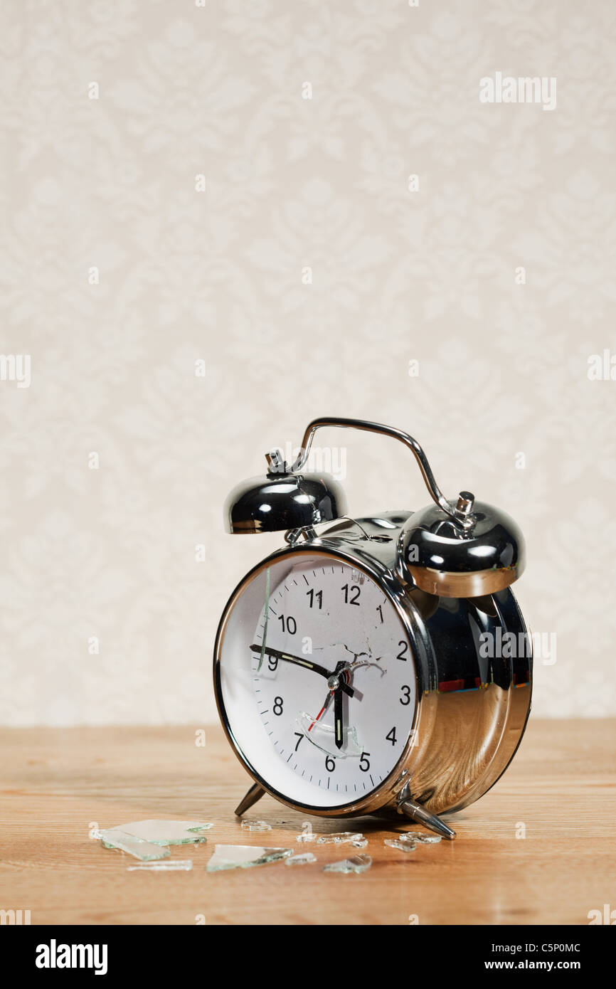 Smashed alarm clock Stock Photo - Alamy