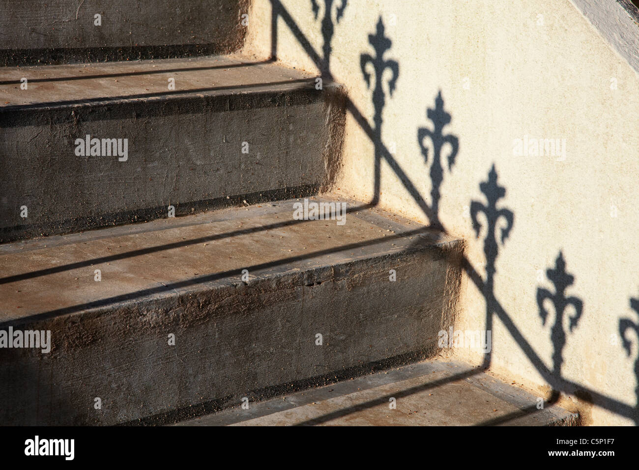 Steps and railing shadow Stock Photo - Alamy