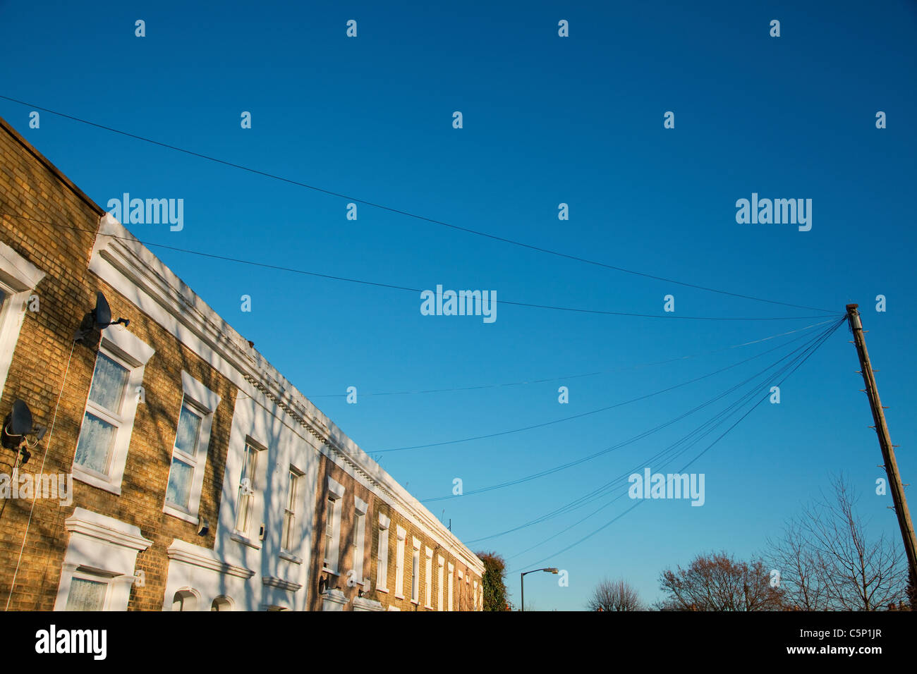 House exteriors against blue sky Stock Photo - Alamy