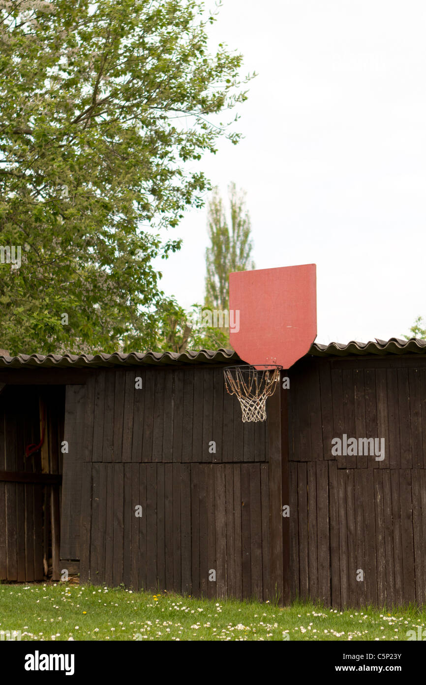 red basketball hoop in the garden Stock Photo Alamy