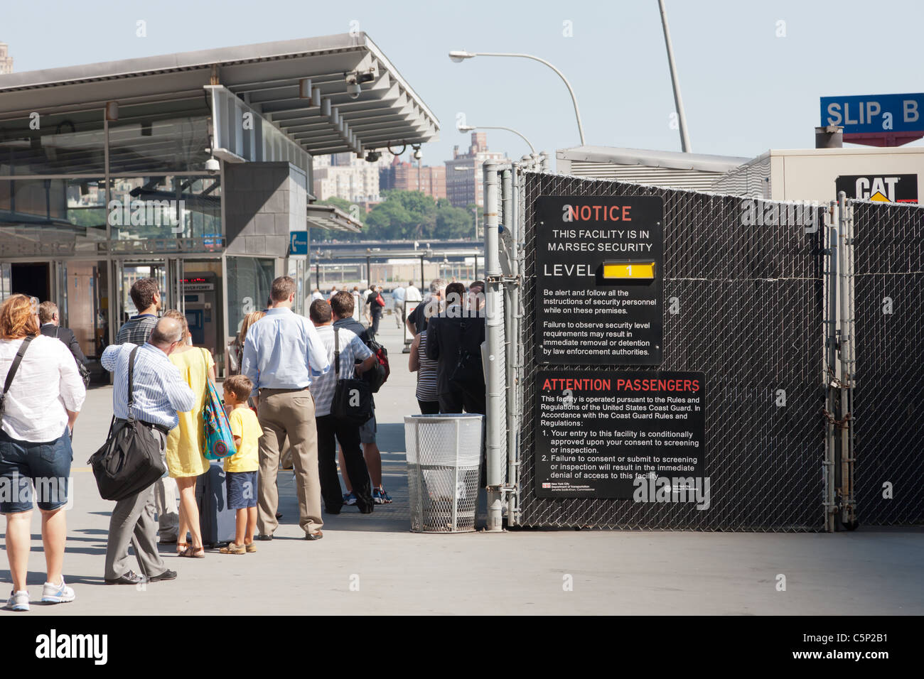 Ferry passengers enter New York Waterway Pier 11 / Wall Street ferry terminal during the afternoon rush hour in New York City. Stock Photo