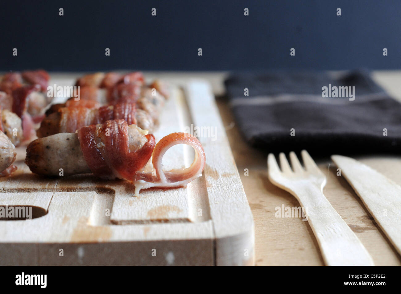 Cocktail sausage wrapped in bacon Stock Photo