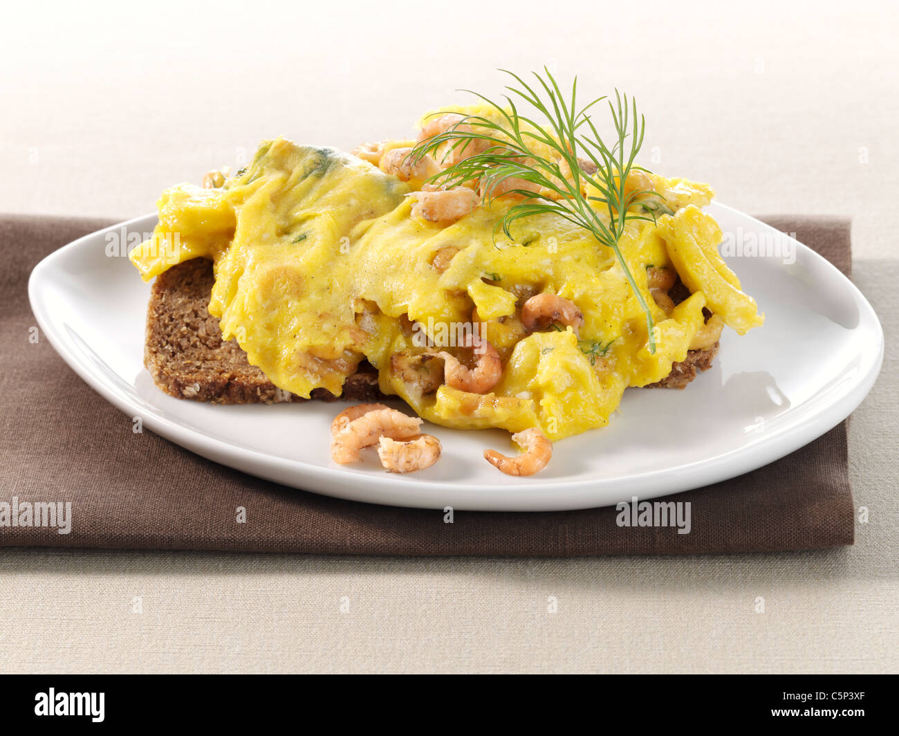 Scrambled eggs with crabmeat on wholemeal bread Stock Photo Alamy