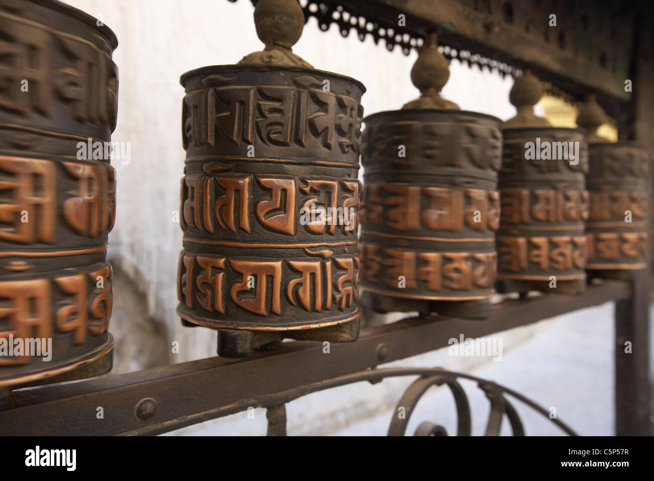 Tibetan Buddhist prayer wheels in motion at the temple of Swayambhunath ...