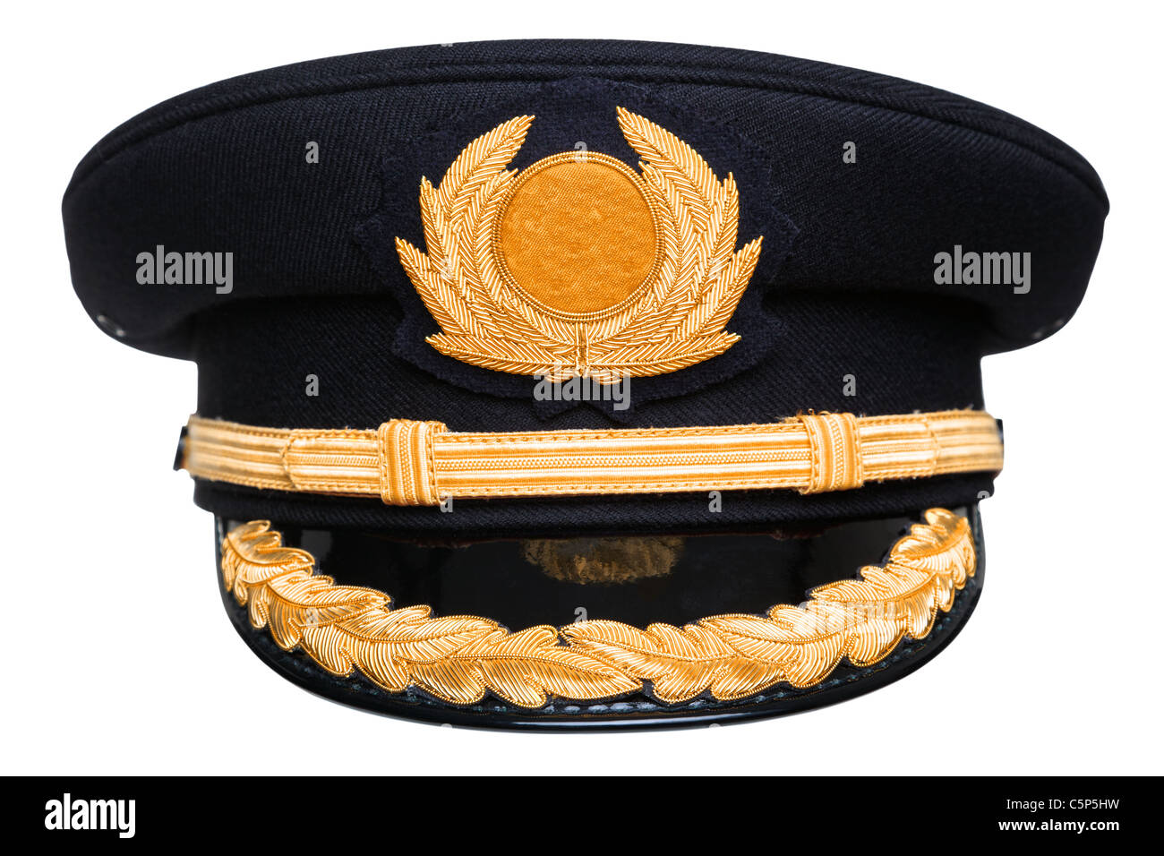 Photo of an airline pilots hat or cap with gold insignia, isolated on a white background with clipping path. Stock Photo