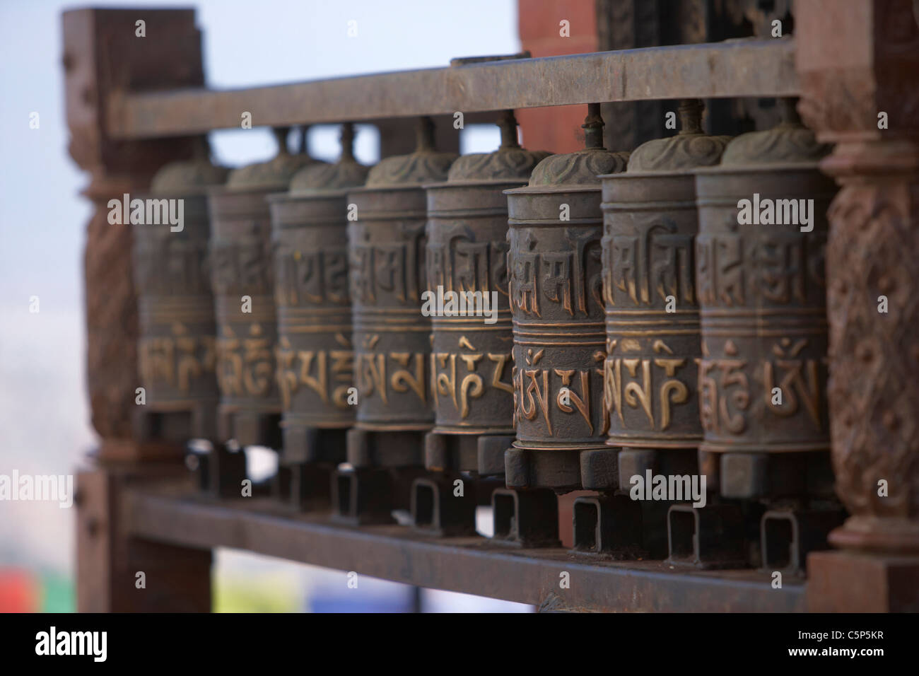 Tibetan Buddhist prayer wheels at the temple of Swayambhunath or monkey ...
