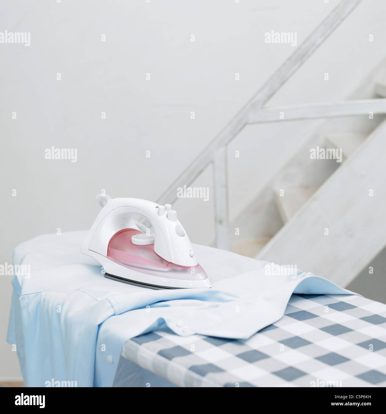 Ironing board and iron Stock Photo