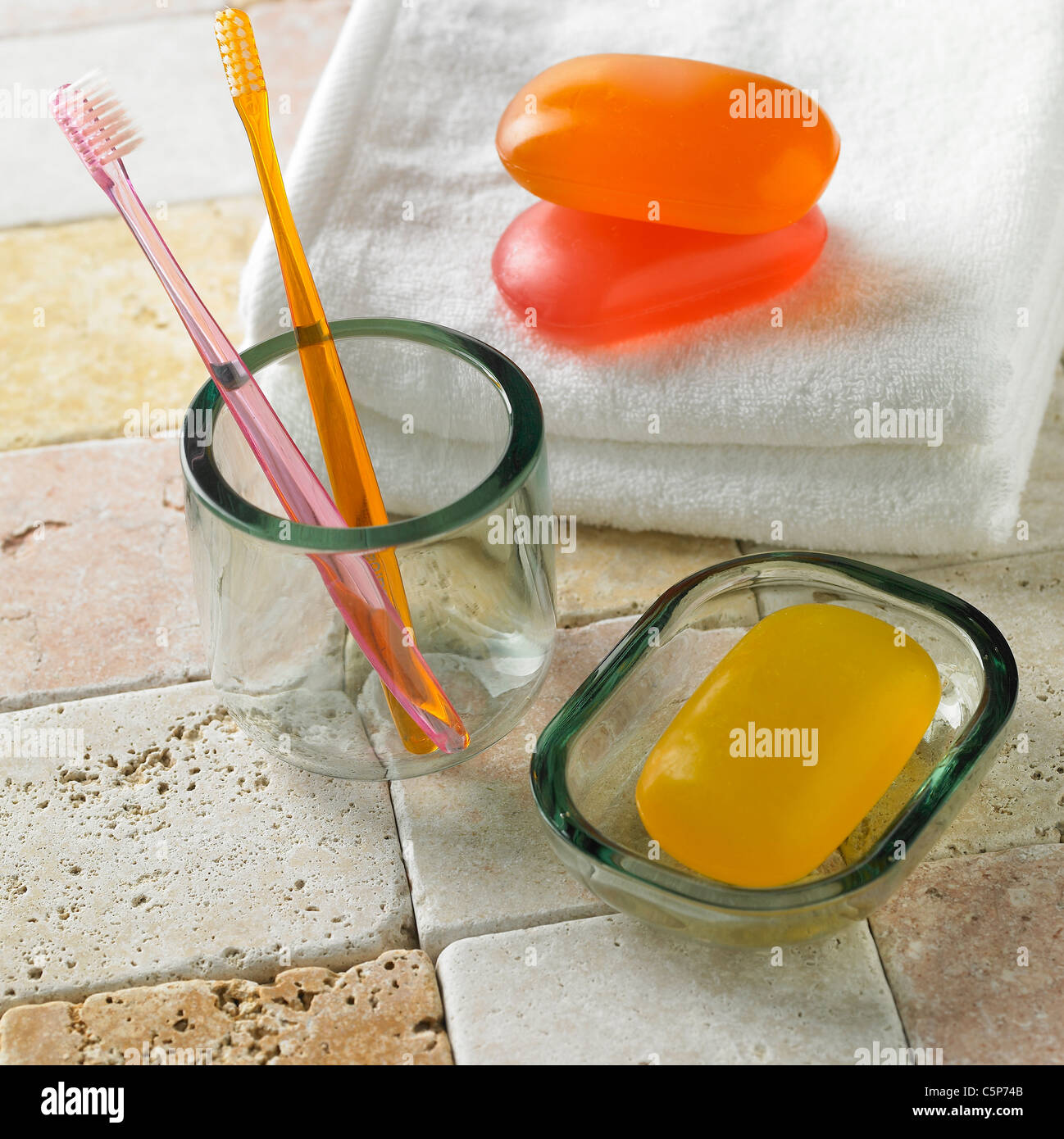 Toothbrush, soap and towels Stock Photo