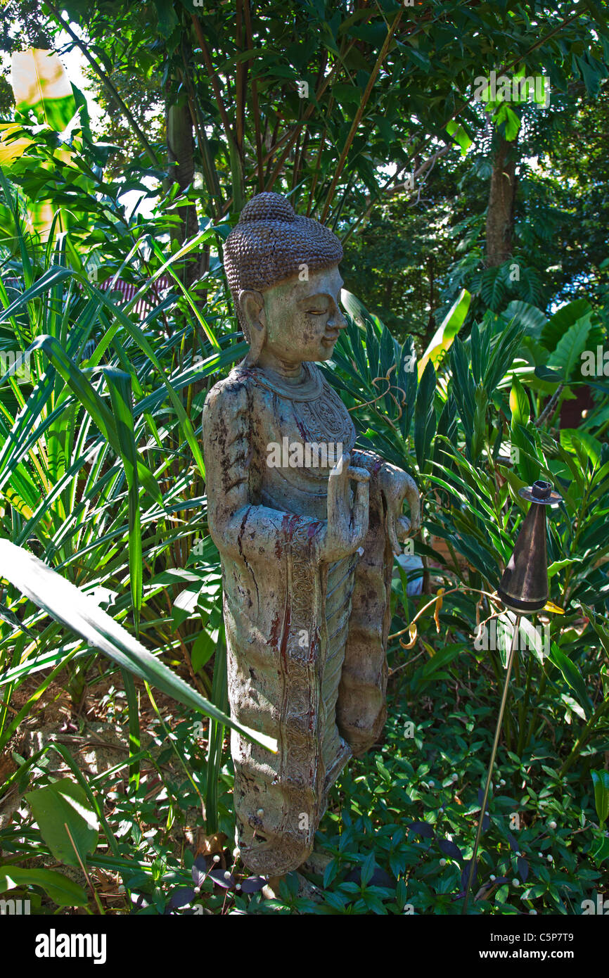 Buddha statue in tropical garden Thailand Stock Photo