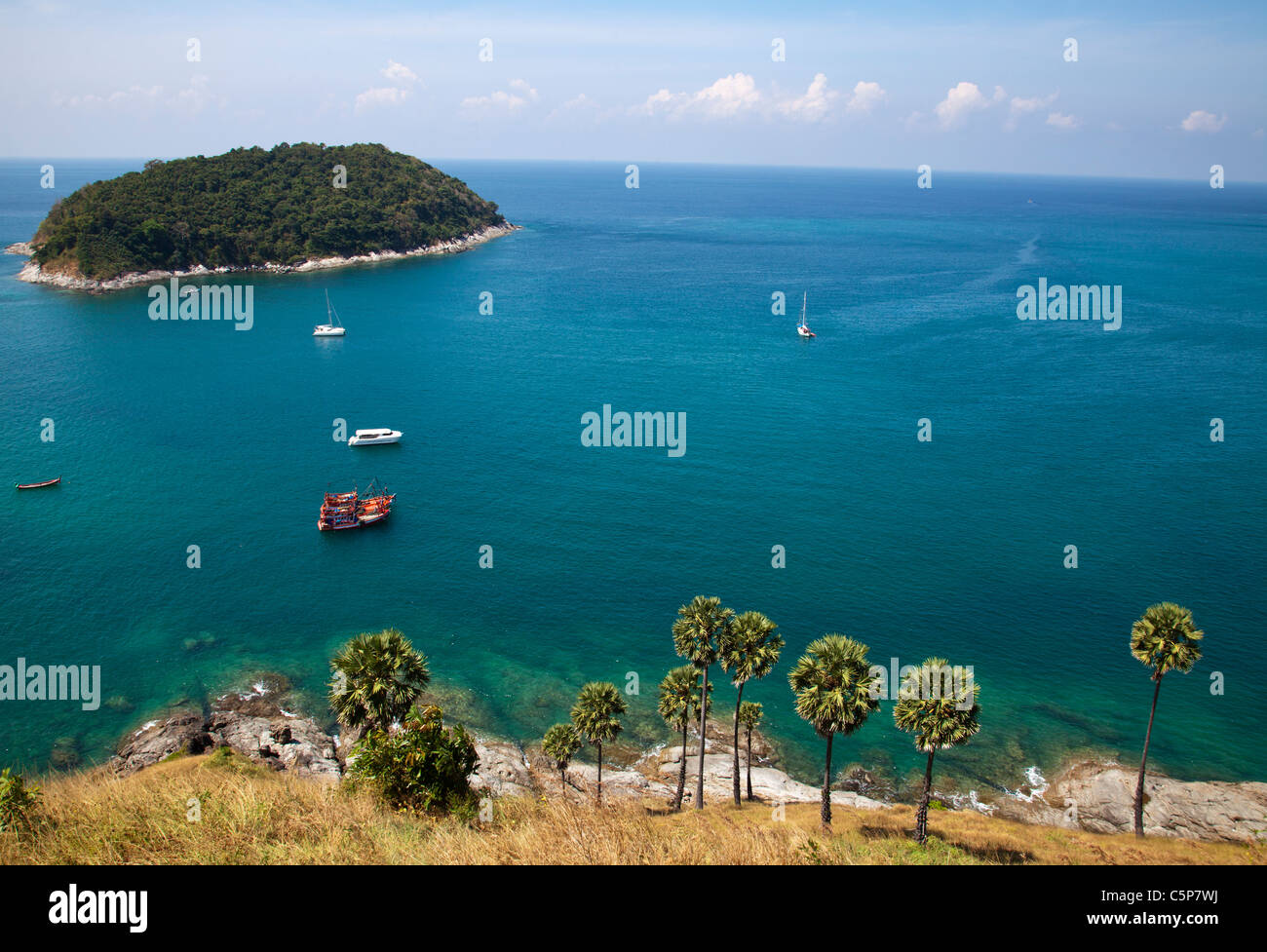 View over coastline island and clear blue water Cape Promthep Phuket Thailand . Stock Photo