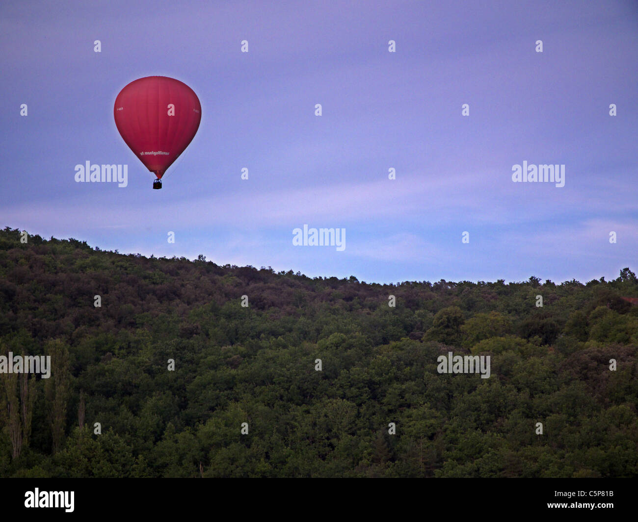 Hot air ballooning over Les Milandes village. St Cyprien. Dordogne France Stock Photo