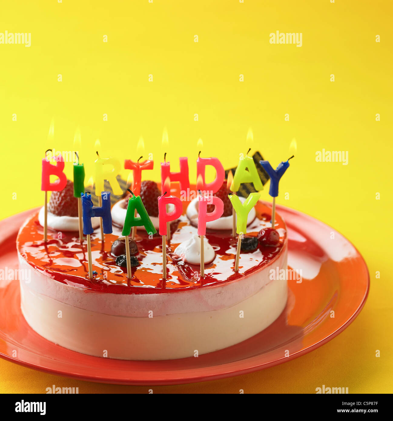 A cake with candles on Stock Photo - Alamy