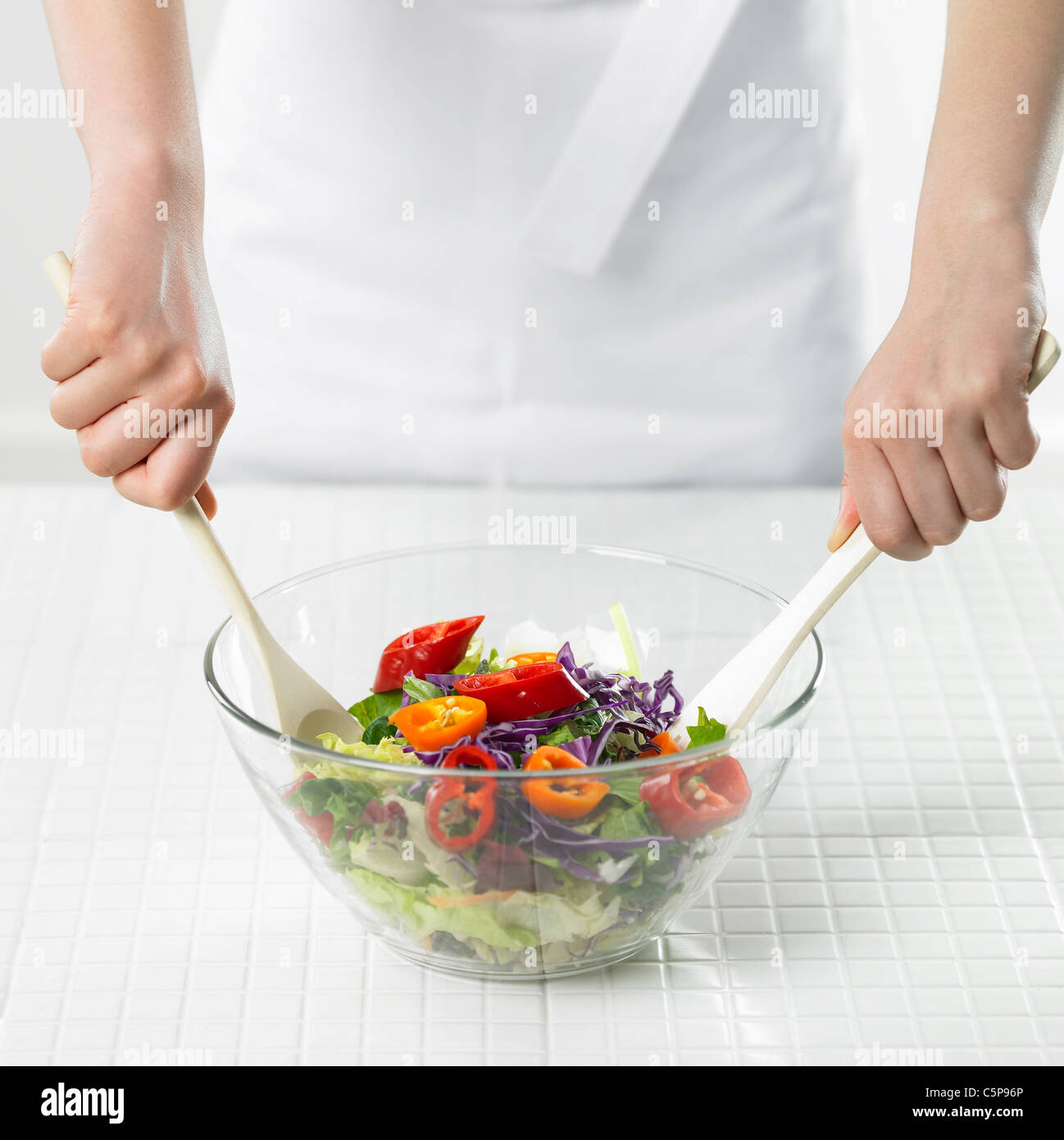 A person mixing vegetables Stock Photo Alamy