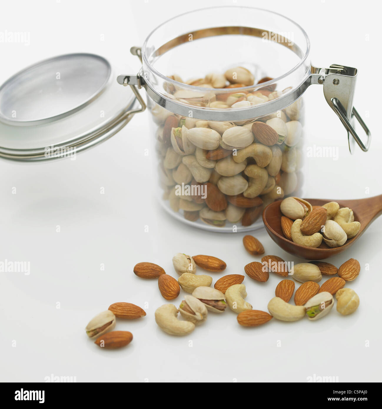 Nuts with container Stock Photo Alamy