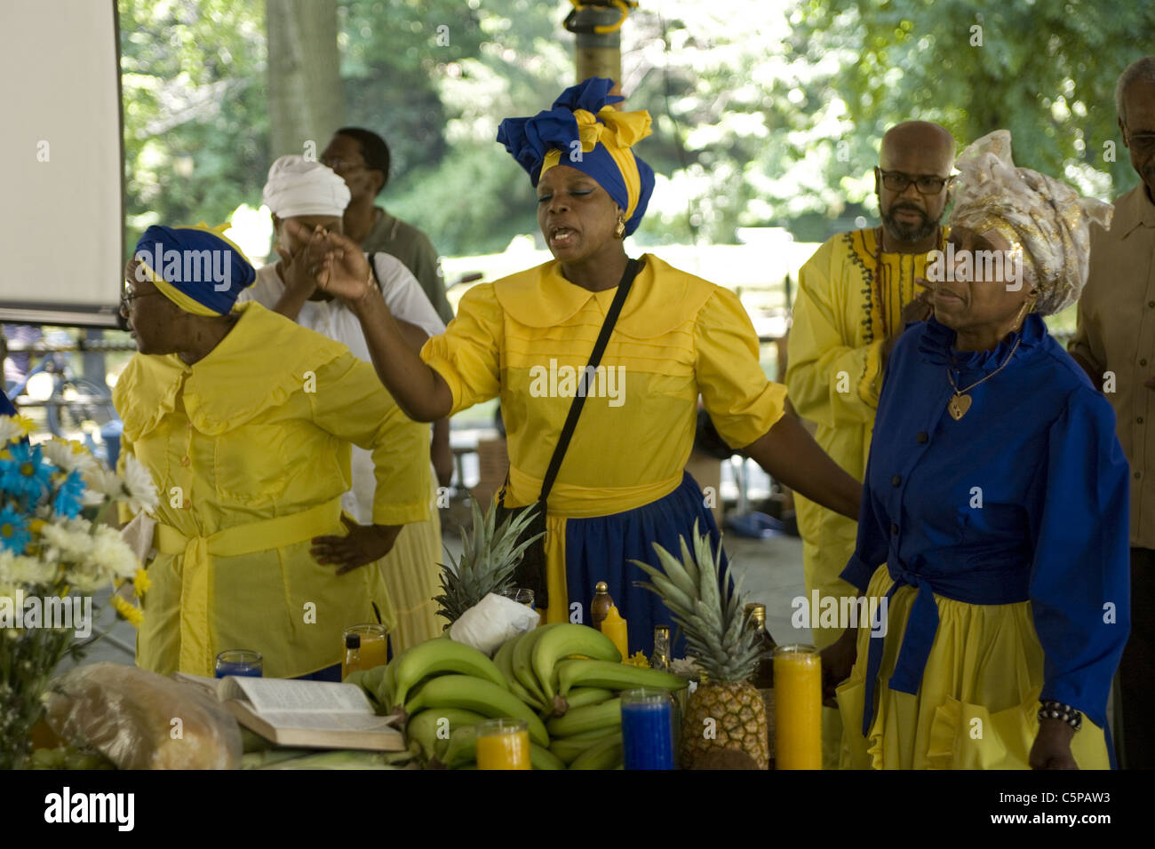 Caribbean Christian Church holds outdoor 'service of thanks' blessing food, singing gospels and giving praise Stock Photo