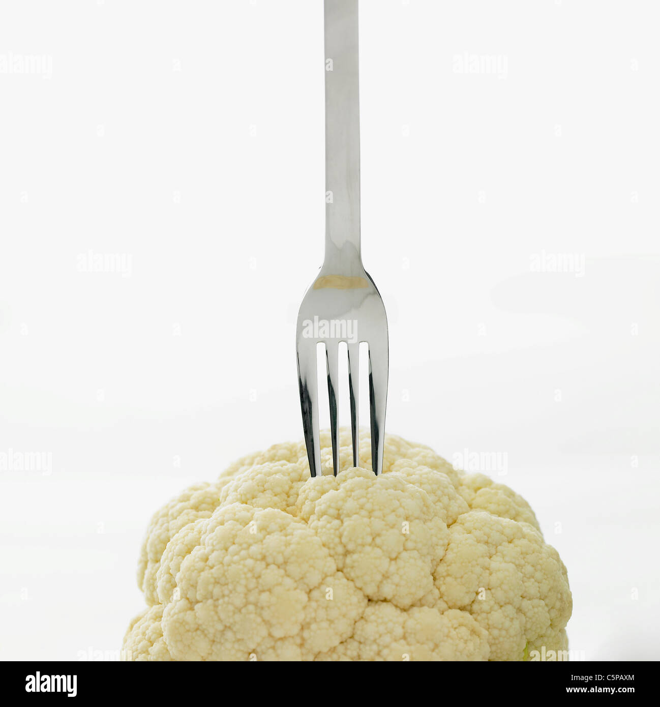 Cauliflower with fork Stock Photo Alamy