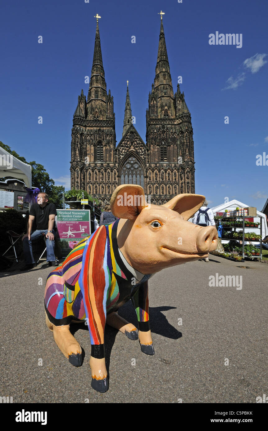 Fibreglass pig decorated for Lichfield Festival summer 2011 in front of Lichfield Cathedral Staffordshire England Stock Photo