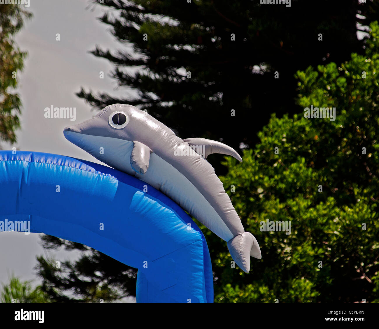 Dolphin in the Sky (Tursinops plasticus inflatus) on an inflated Bounce House Stock Photo