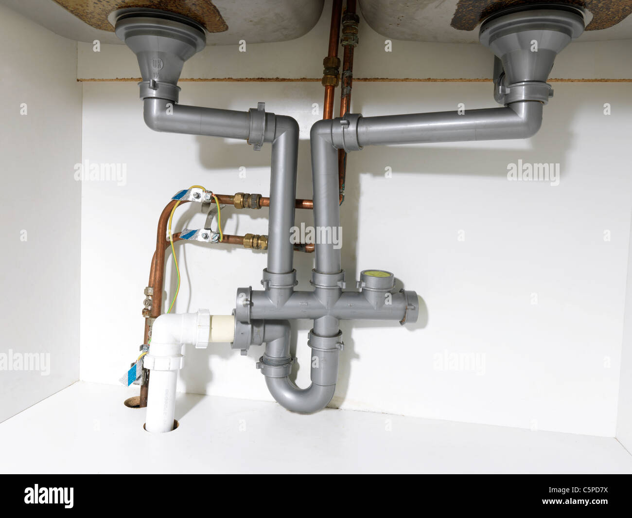 Waste Pipe And Fittings Under A Double Kitchen Sink And